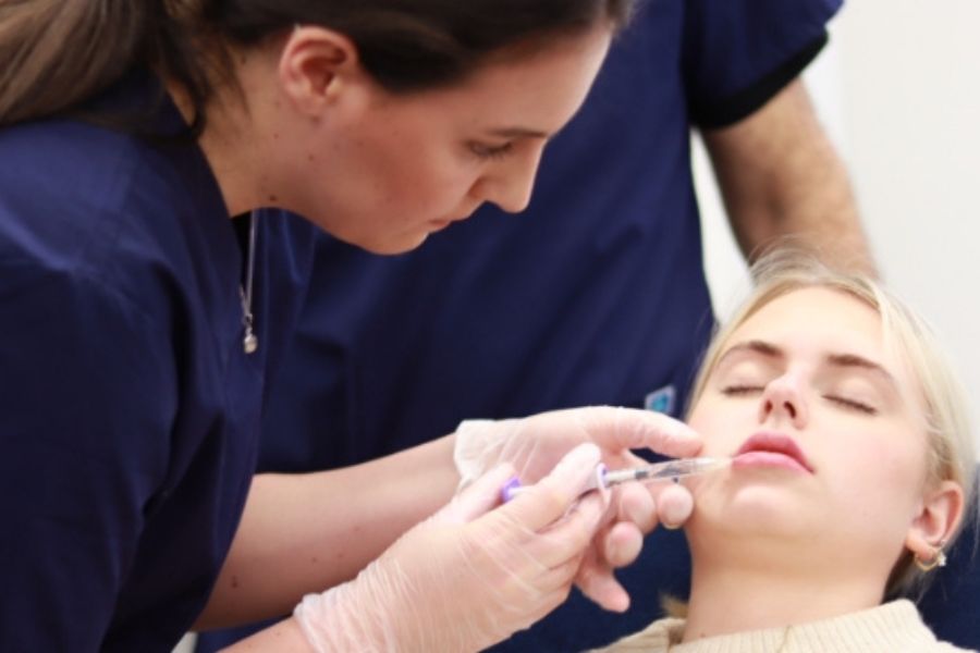 Lip filler training course practice on live model